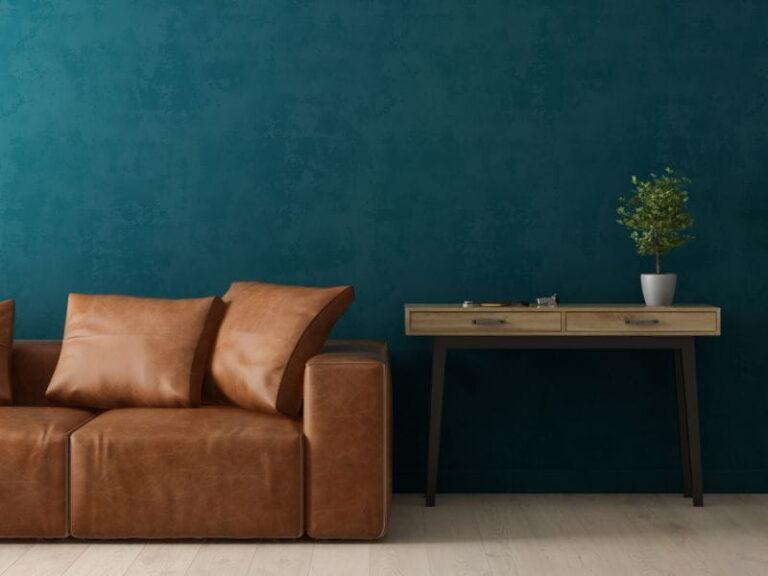 Imagem de sala de estar com parede na cor verde